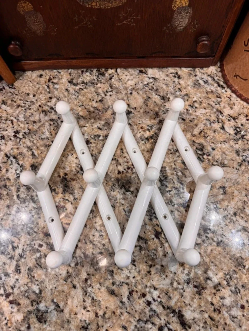 Vintage white plastic 10 peg accordion rack